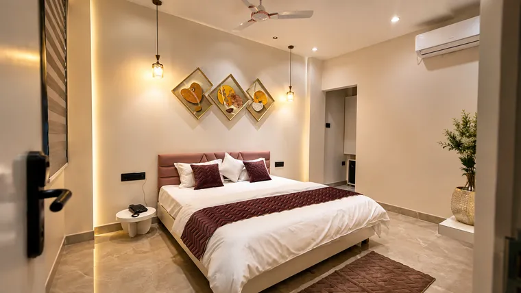 Deluxe Room king bed layout at Erleen Hotel